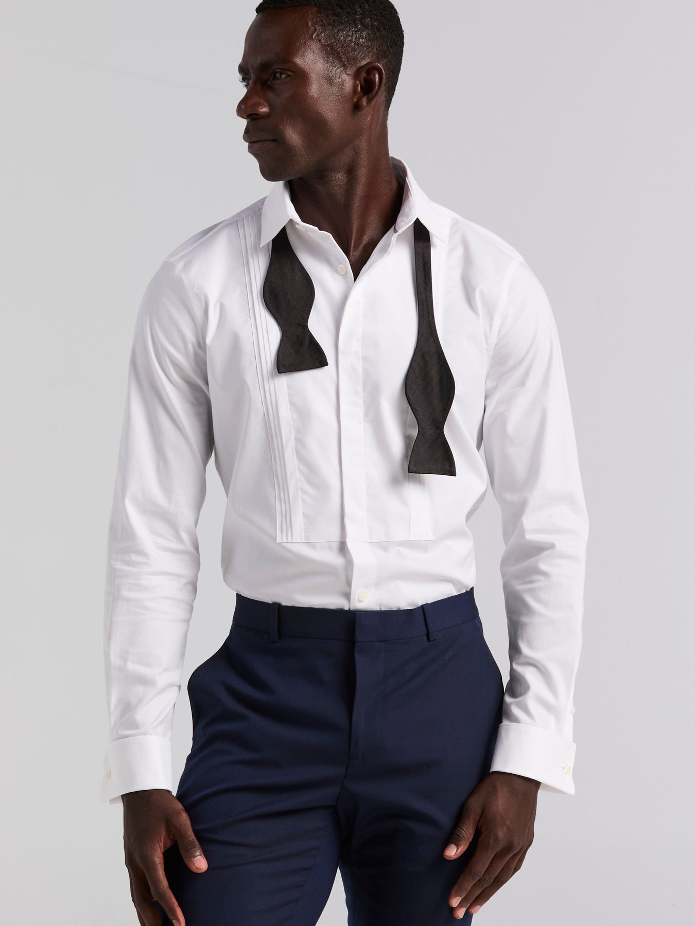 white dress shirt with black collar Men's White, Banded Collar, Long Sleeve Piping Two buttons are included on each sleeve cuff to adjust a comfortable fit Perry Ellis Men's Slim Fit