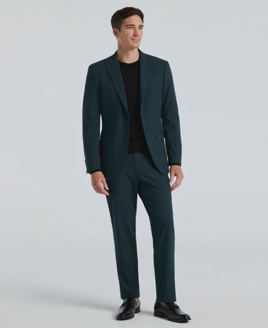 Man wears Perry Ellis Slim Fit Louis Suit Pant in color Magical Forest