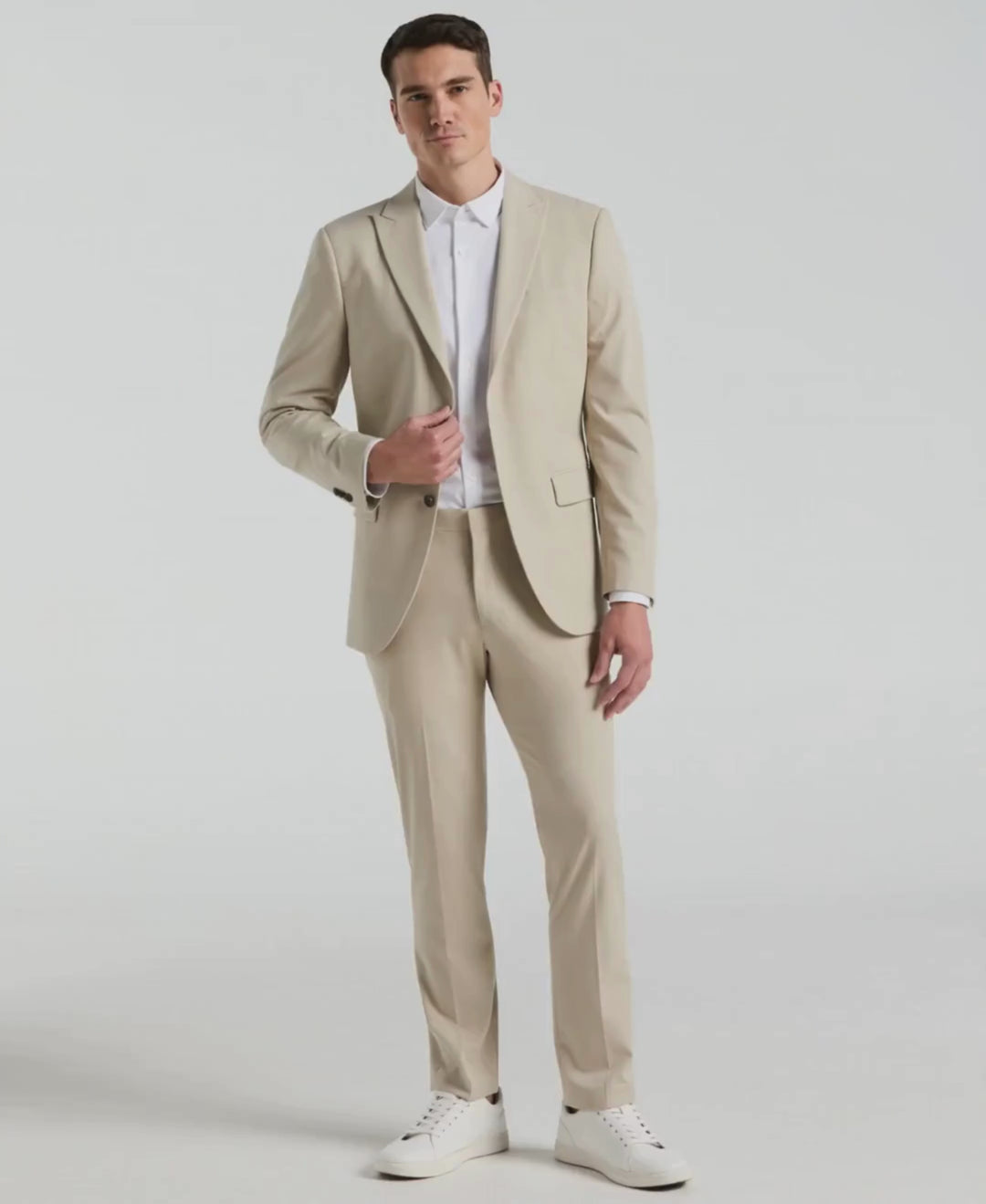 Video of a man wearing the Slim Fit Louis Suit Pant in the coor Island Fossil